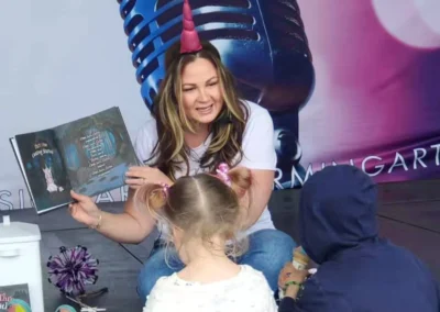 Author showcasing her book.