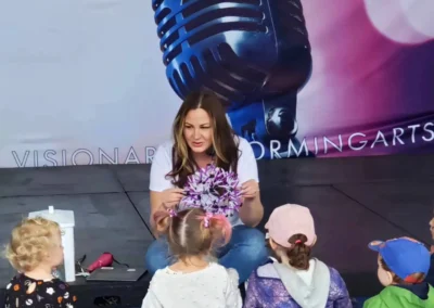 Kathy presents to a group of children.