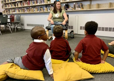 Author reading from a book to a group of children.